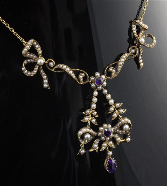 An Edwardian 9ct gold, amethyst and seed pearl drop necklace, 17.5in.